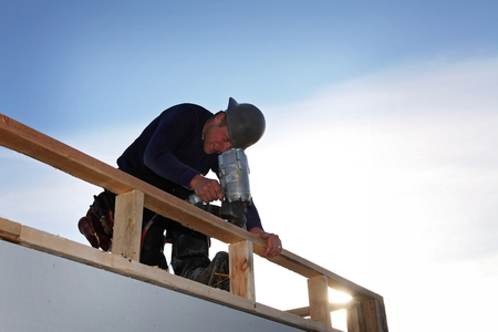 A carpenter working on a consruction siteの写真素材