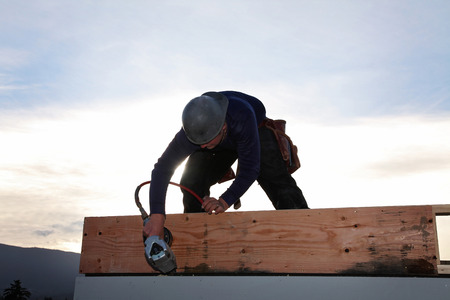 A carpenter working on a consruction siteの写真素材