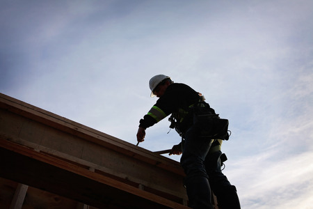 A carpenter working on a consruction siteの写真素材