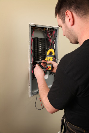 An Electrician working on a new construction siteの写真素材