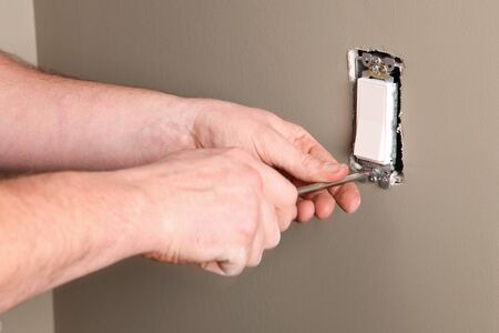 An Electrician working on a new construction siteの写真素材