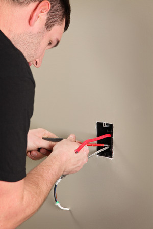 An Electrician working on a new construction siteの写真素材