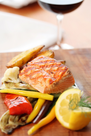 Close up of a grilled salmon decorated on a plateの写真素材