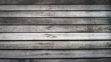 Wooden texture of a bridge. Very rough wood floor. Brown and grey wood background.の写真素材
