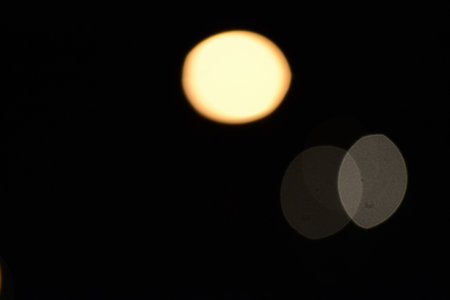 Abstract background. blur bokeh. Blurry yellow light from the lamp.