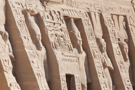 Close-up of two of the Sculptures of King Ramses II and queen Nefertari in Abu Simbel Temple Egypt