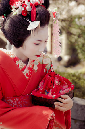 Kamishichiken Kyoto, Japan-April 03,2009 Maiko has attent to Baika-sai Festival also Baien Ume Gardenのeditorial素材