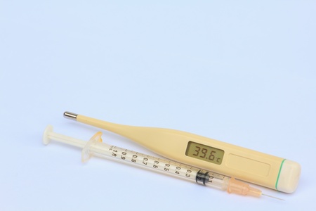 Synringe and Electronic Termometer on the Isolated Background.の写真素材