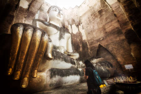 The woman pray to Buddha.の写真素材
