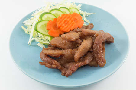 Fried pork with vegetable in isolate background.の写真素材
