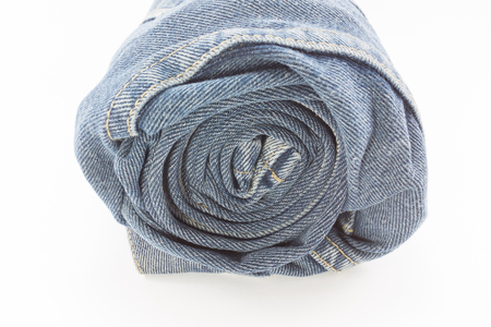 Roll of blue jean on white background.の写真素材