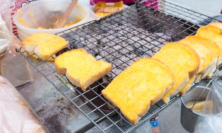 white bread toasted with butter and sugarの写真素材