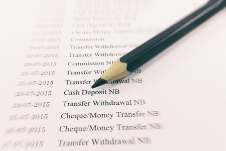 Bank statement paper with pencil on zoom effect : Can used for financial background.の写真素材