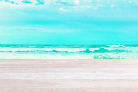 Plank wood or table top on blurred colorful sea : Suitable use for holiday or summer concept.の写真素材