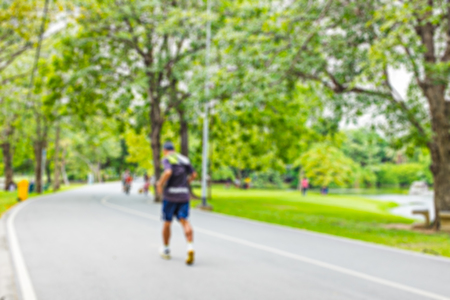 Colourful blurred image of people jogging in the parkの写真素材