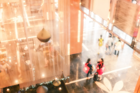 Blurred people standing at hotel lobby.の写真素材