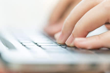 Hand on computer keyboard for business concept background (Select focus).