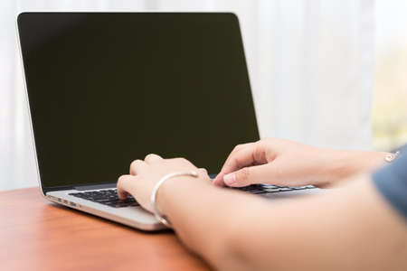 Hand on computer keyboard for business concept background (Select focus).の写真素材