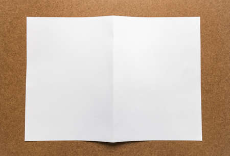 Brown paper note on business wood desk with copy space.の写真素材