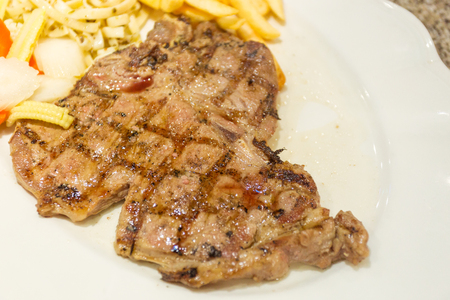 Beef steak on white plate for dinner.の写真素材