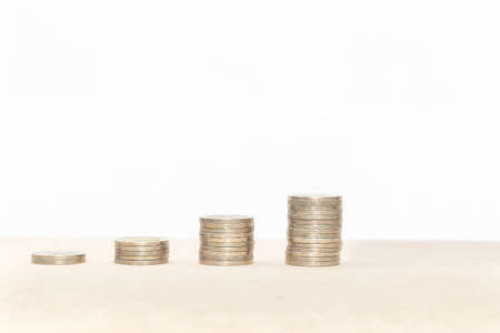 Stacking coin with copy space on white background : Can use for your growing money concept background.の写真素材