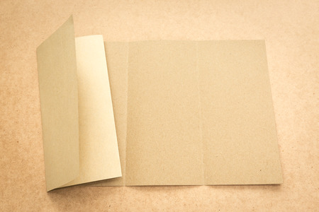 White paper note on business wood desk with copy space.