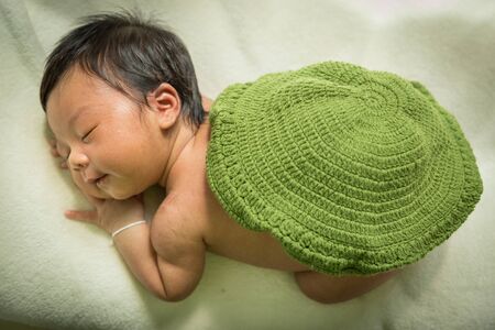 Baby cute girl sleep with smiling on mattress.の写真素材