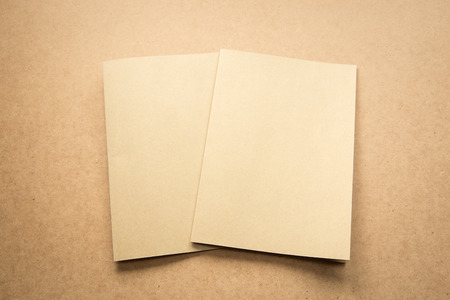 White paper note on business wood desk with copy space.