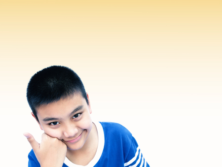 Asian teen show his thumb up with copy space.の写真素材