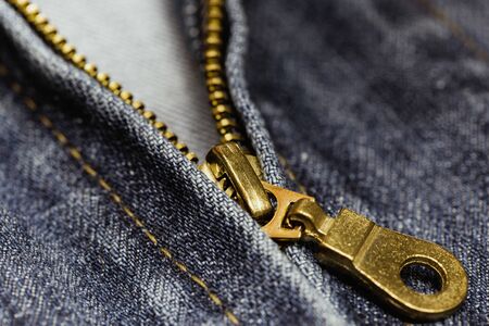 Metal zipper on blue jean. (Selected focus)の写真素材