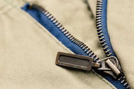 Grung metal zipper on pants for background.の写真素材