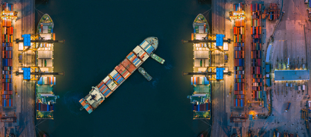 Aerial view container ship from sea port working for delivery containers shipment. Suitable use for transport or import export to global logistics concept.の写真素材