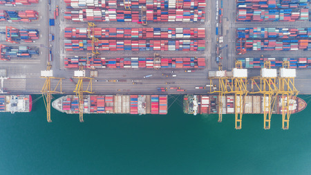 Aerial view container ship and container warehouse from sea port for delivery containers shipment....