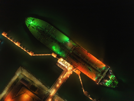 Oil ship tanker unloading at night for transportation crude oil in the sea.の写真素材