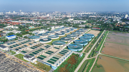 Aerial view water treatment plant with cityscape for environment concept.の写真素材