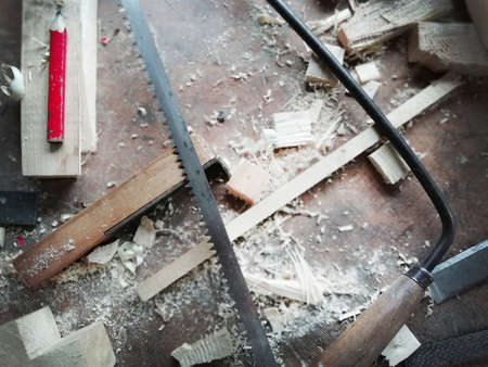 Top of view vintage carpenter tools in a carpentry workshop, hand saw, home wood kit closeupの写真素材