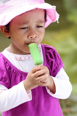  little girls eating an ice creamの写真素材