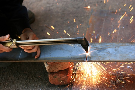 gas cuting torch with flame cut the metalの写真素材