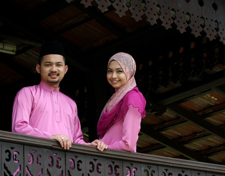 Muslim couple with greeting Hari Rayaの写真素材