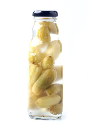 Bottled of bilimbi citrus on white backgroundの写真素材