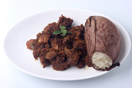 Glutinous rice cooked in pitcher plant leaves with beef rendangの写真素材