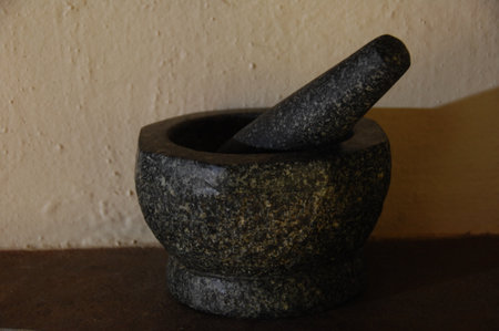 Mortar and pestle in a stone mortar and pestleの写真素材