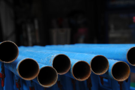 Blue plastic pipes for water supply in a factory, closeup of photoの写真素材