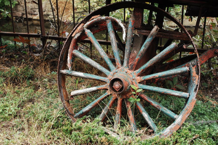 Old wooden wheel of an old wagon, closeup of photo.の写真素材