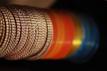 Close-up shot of a coil of copper wire on black background