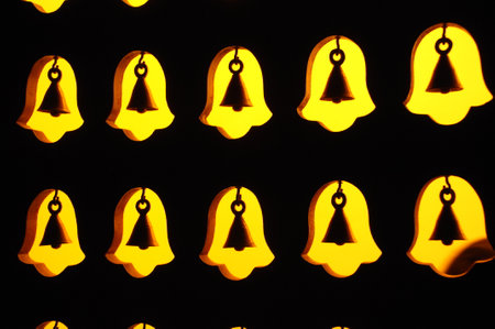 Close up view of a group of christmas bells in the darkの写真素材