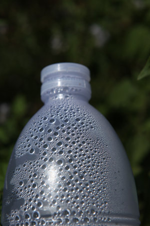 Plastic bottle of water on a green background, close-upの写真素材