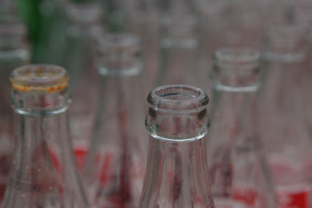 Close up of glass bottles in a row, can be used as backgroundの写真素材