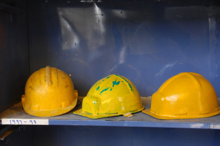 Safety helmets on the shelf in the factory, closeup of photoの写真素材