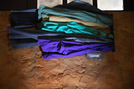 clothes hanging on the wall, closeup of photo with soft focusの写真素材